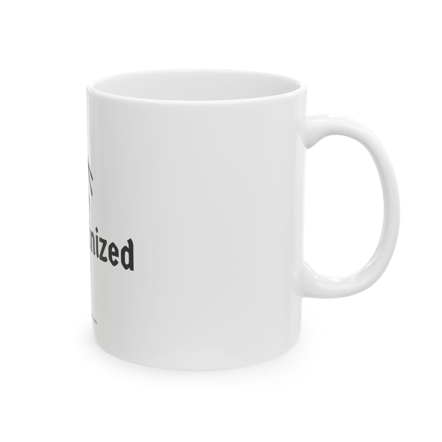 White mug angled to show the second half of the Die Organized print