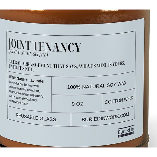 Close-up of the Joint Tenancy candle label: a legal arrangement that says, what's mine is yours, until it's not. White Sage and Lavender, 100% natural soy wax, cotton wick, reusable glass