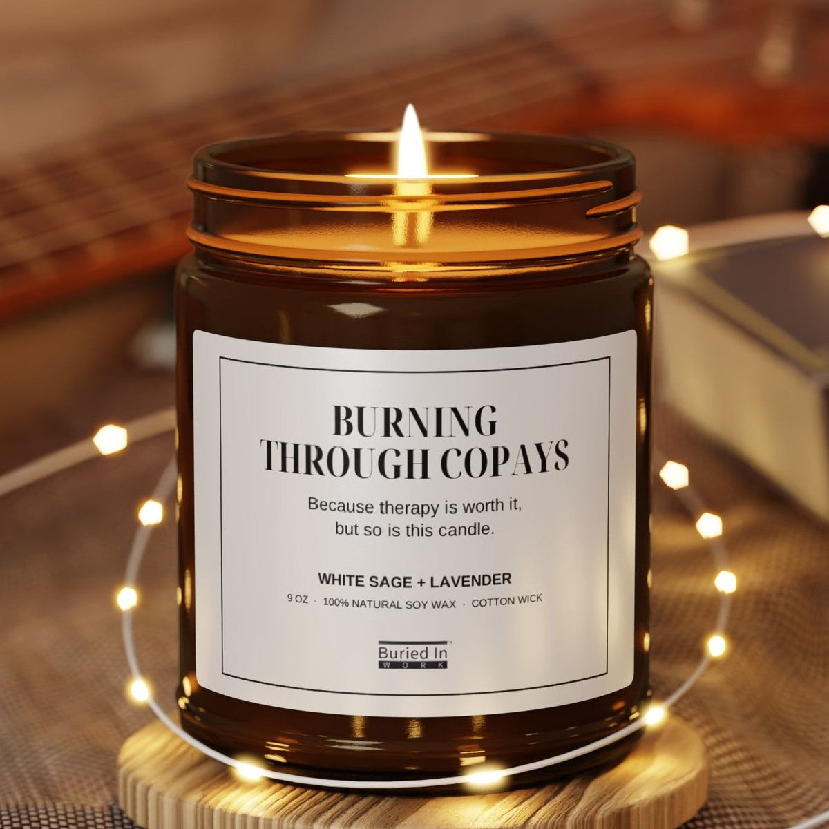 Burning Through Copays candle lit, with string lights