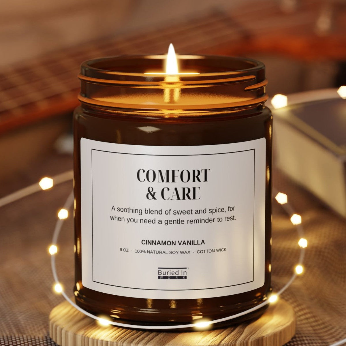 Comfort & Care candle lit, with string lights