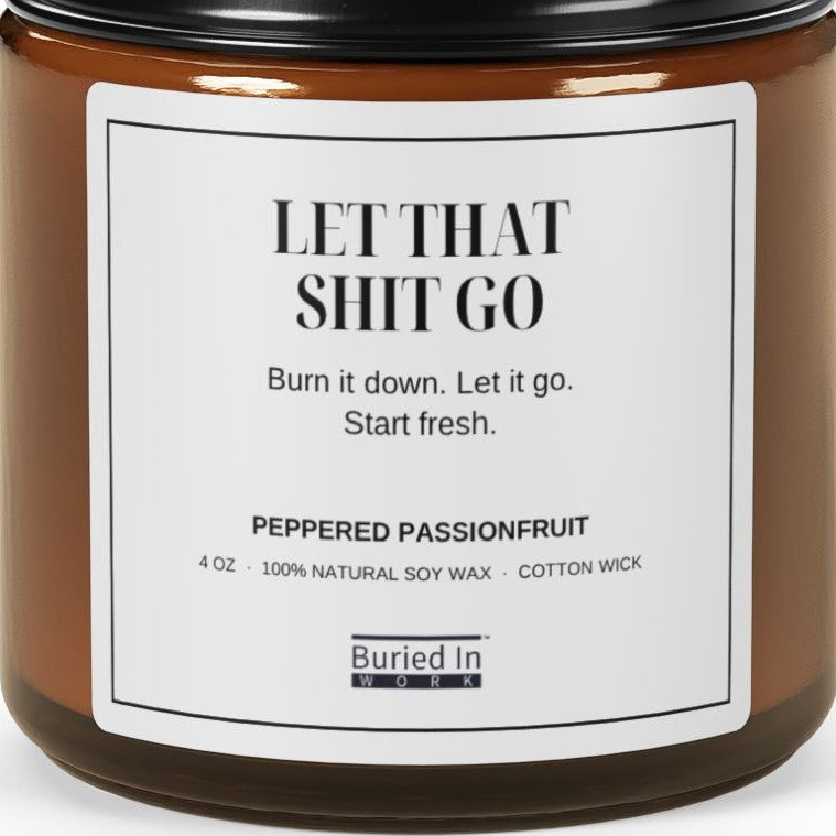 Close-up of the Let That Shit Go candle label
