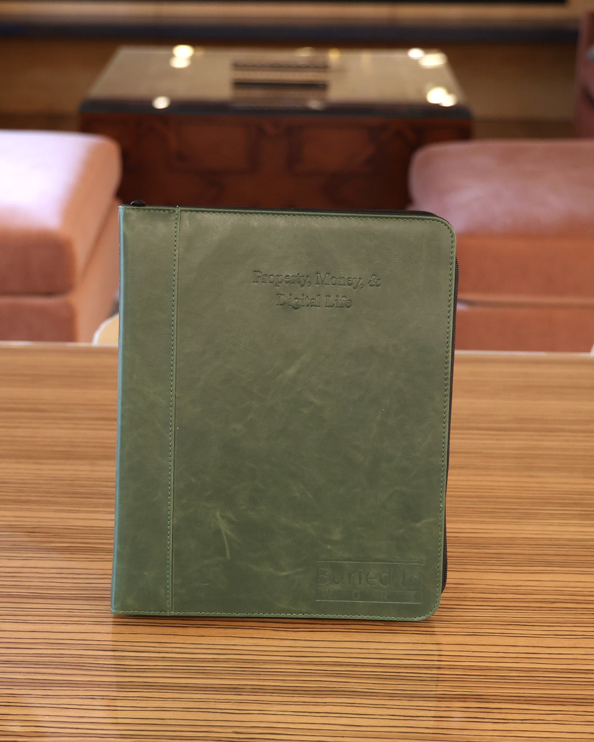 The green CLEAR Kit Expanded binder standing on a table