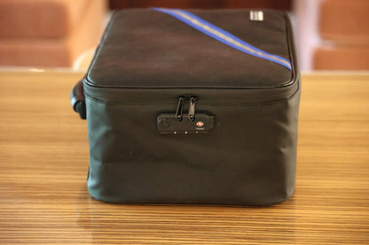 Close-up of the TSA-style combination lock and zipper pulls on the large storage case