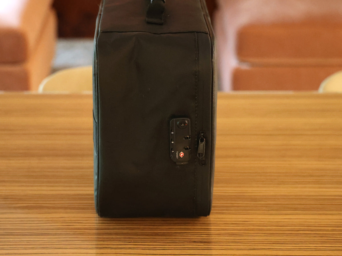 Side view of the large storage case showing the combination lock and carry handle