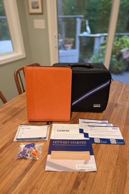 CLEAR Kit Essentials: orange binder, storage case, Getting Started guide, notification cards, and key storage kit