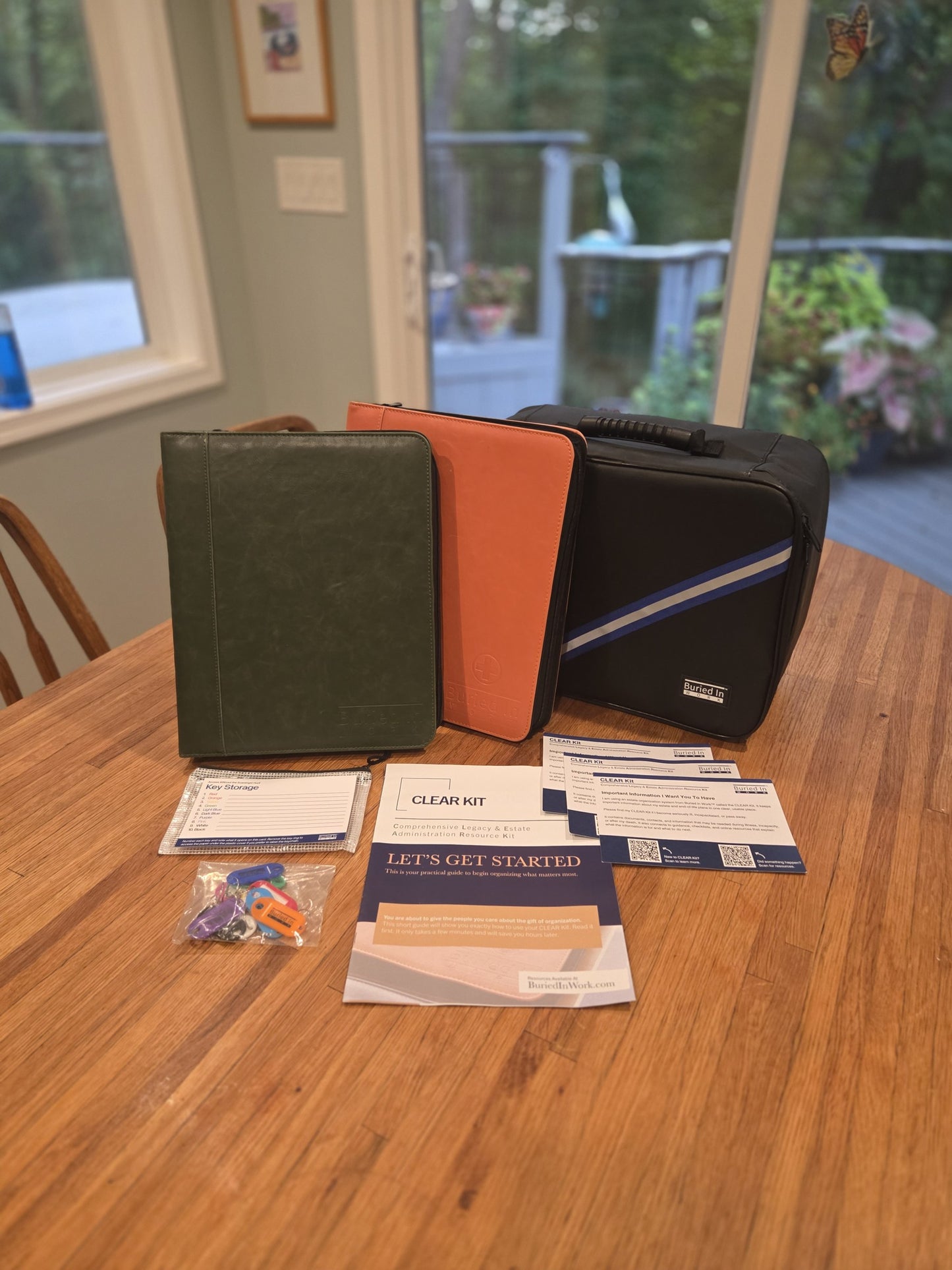 CLEAR Kit Expanded: green and orange binders, storage case, Getting Started guide, notification cards, and key storage kit