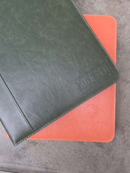 The green Expanded binder with the orange Core Essentials binder it joins
