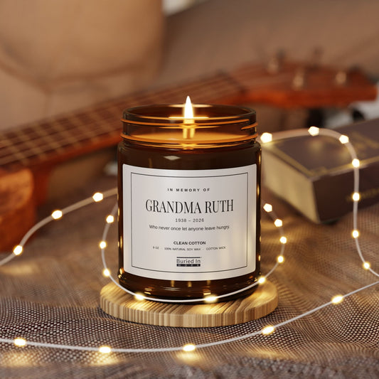 In Memory Of personalized candle, lit, with the name Grandma Ruth on the label