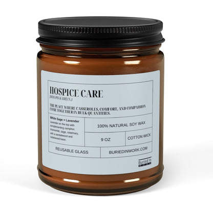 Hospice Care soy candle in an amber glass jar with a black lid, front label reading Hospice Care with its dictionary definition