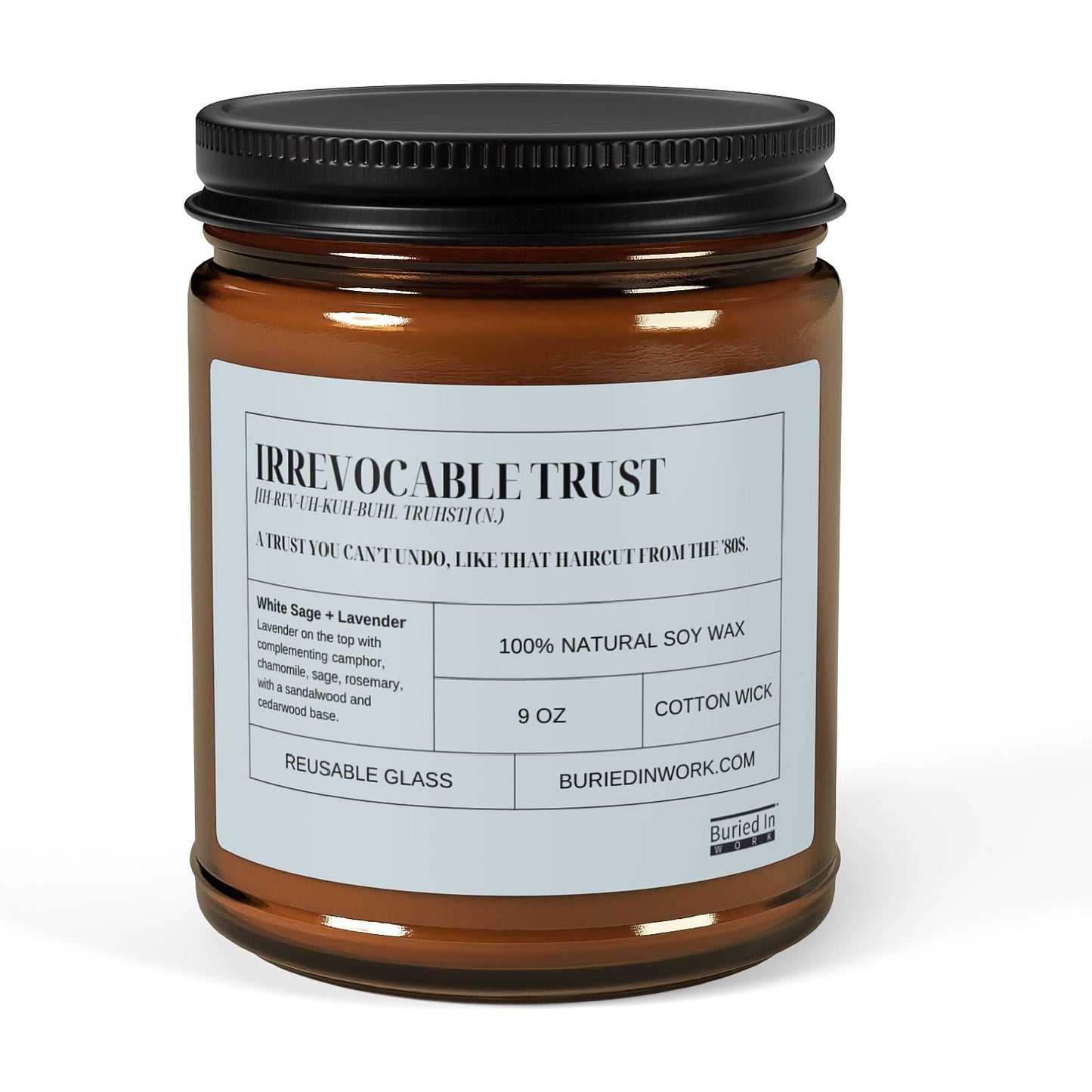 Irrevocable Trust soy candle in an amber glass jar with a black lid, front label reading Irrevocable Trust with its dictionary definition