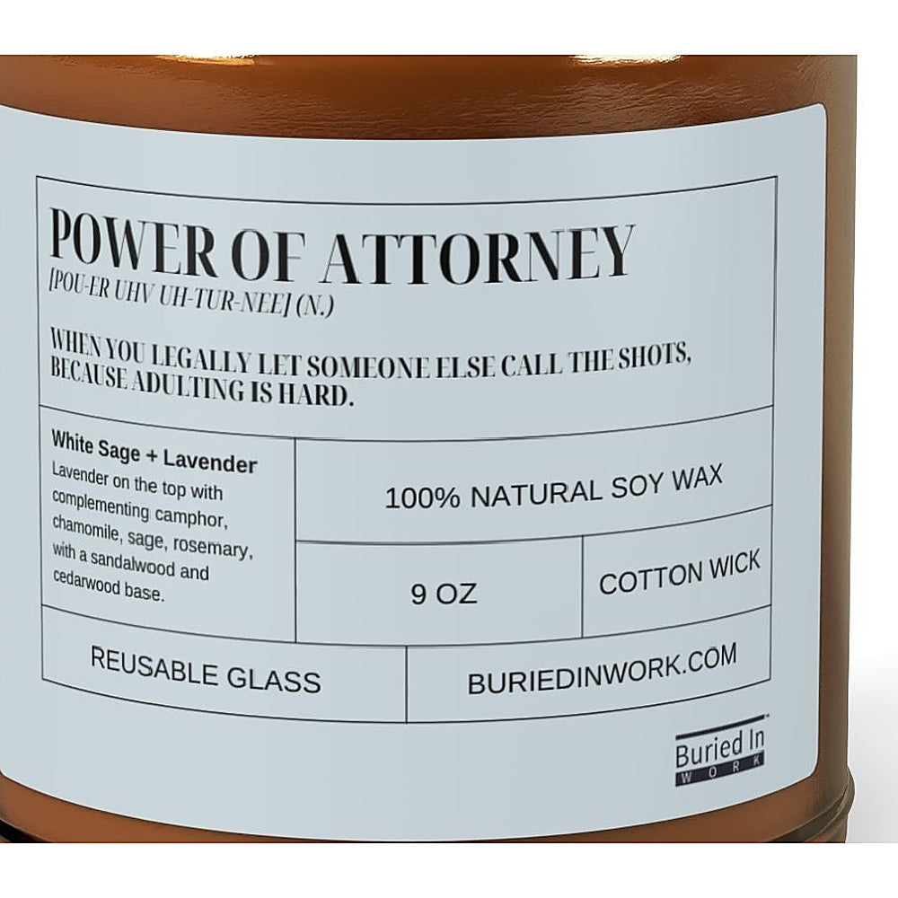 Close-up of the Power of Attorney candle label: when you legally let someone else call the shots, because adulting is hard. White Sage and Lavender, 100% natural soy wax, cotton wick, reusable glass