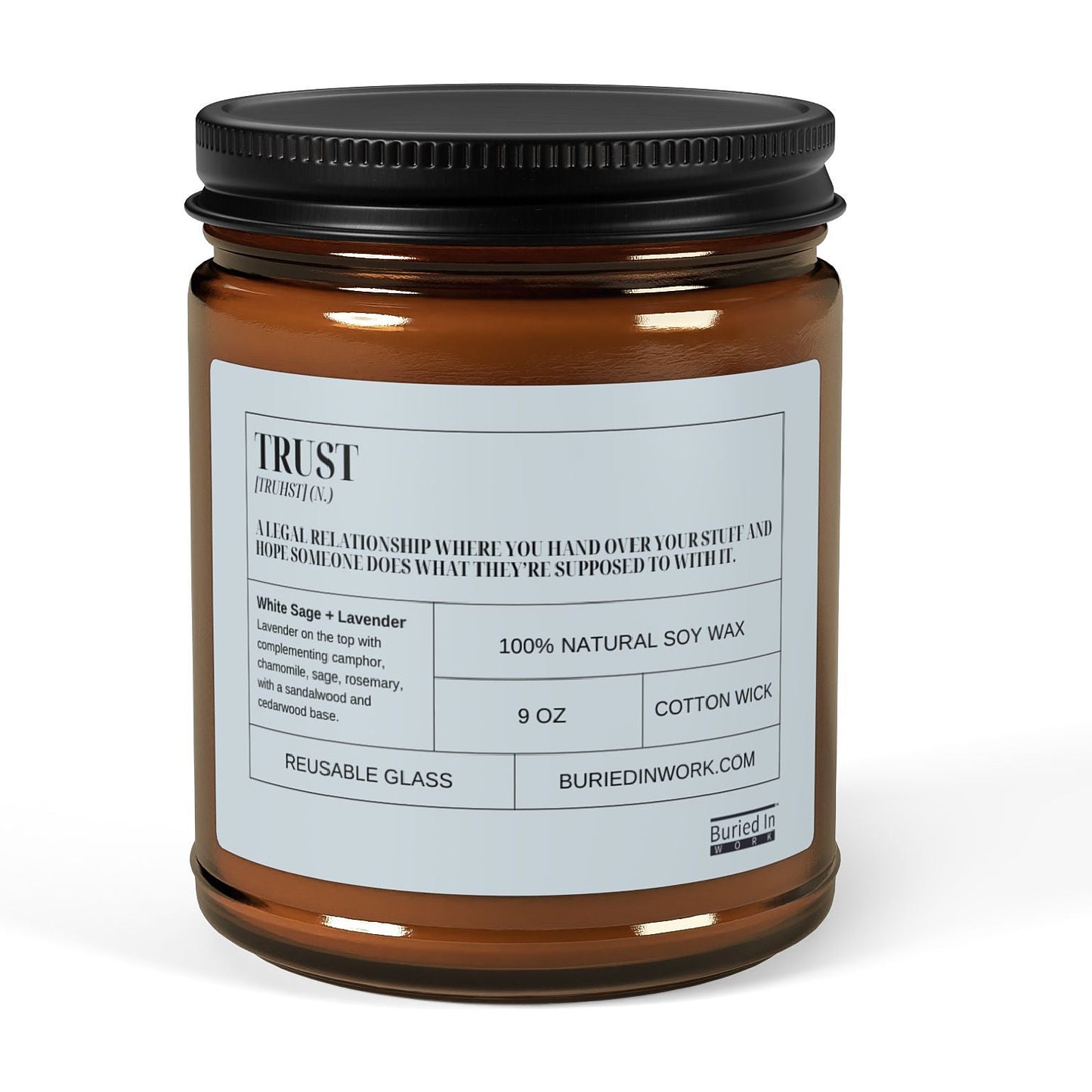 Trust soy candle in an amber glass jar with a black lid, front label reading Trust with its dictionary definition
