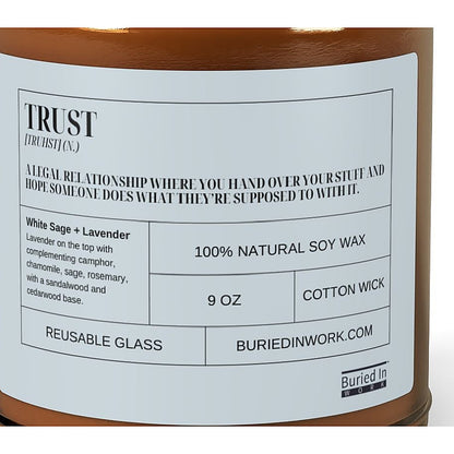 Close-up of the Trust candle label: a legal relationship where you hand over your stuff and hope someone does what they're supposed to with it. White Sage and Lavender, 100% natural soy wax, cotton wick, reusable glass